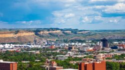 Aerial view of Billings, Montana on a sunny day with mountains in the background